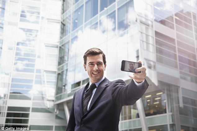 Almost 40 per cent of men pointed their phones upwards to accentuate their height, compared with just 16 per cent of women. Pictured: A man taking a selfie from a low angle 