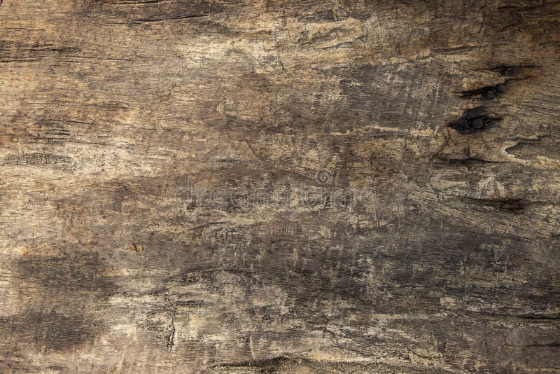 Warm brown wooden table texture flat photo. Timber board with weathered cracks. Rustic wooden table top view. Polish wood backdrop. Grungy lumber flat lay royalty free stock images